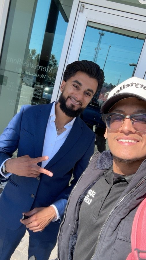 Allan with a client outside a car dealership